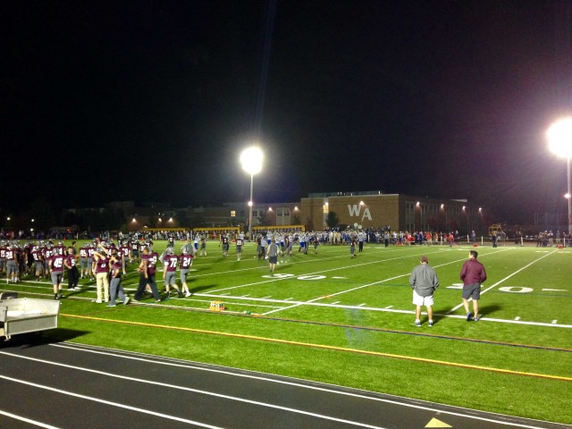 The WA Varsity Football team prepares to depart the field after the tough loss to Acton-Boxboro