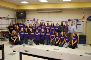 Herren poses with the Project Purple group.