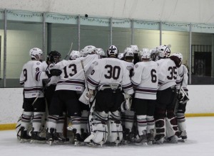 The Ghosts gather around their net prior to puck drop. Photo by: Madie Blais