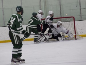 Senior Goalie Matt Restuccia attempts to deny a rebound. Photo by: Madie Blais
