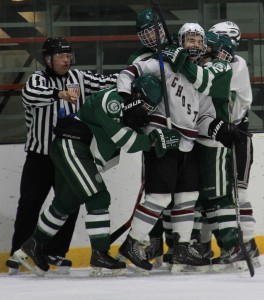 Senior Peter Conway gets into a scrap with Billerica players. Photo by: Madie Blais