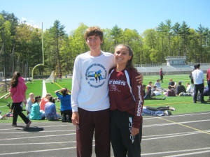 Dolan and Hall pose at track practice.